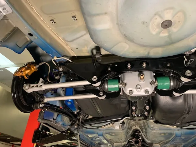 A close up of a car's front suspension.