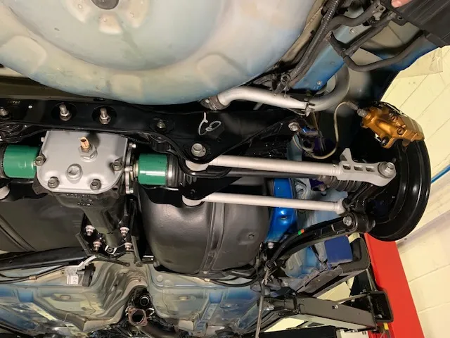 A close up of a motorcycle with a big exhaust pipe.